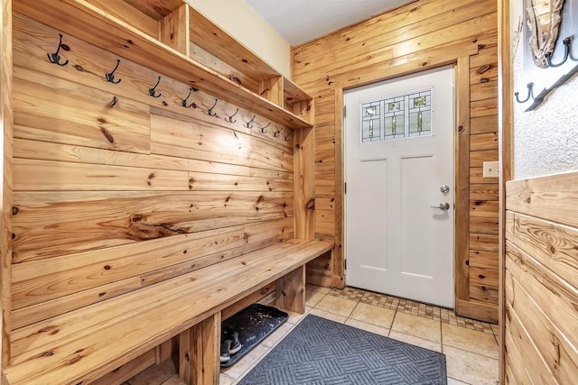 127 Flora St, Pulaski, WI 54162 - mudroom featuring wooden walls, light tile patterned floors, and a sauna / steam room