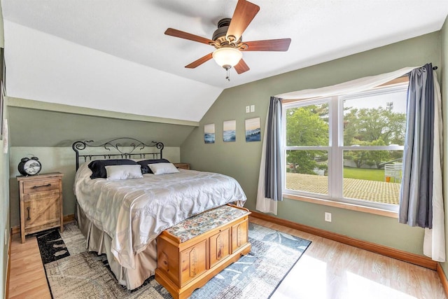 127 Flora St, Pulaski, WI 54162 - bedroom featuring light wood-style flooring, baseboards, lofted ceiling, and ceiling fan