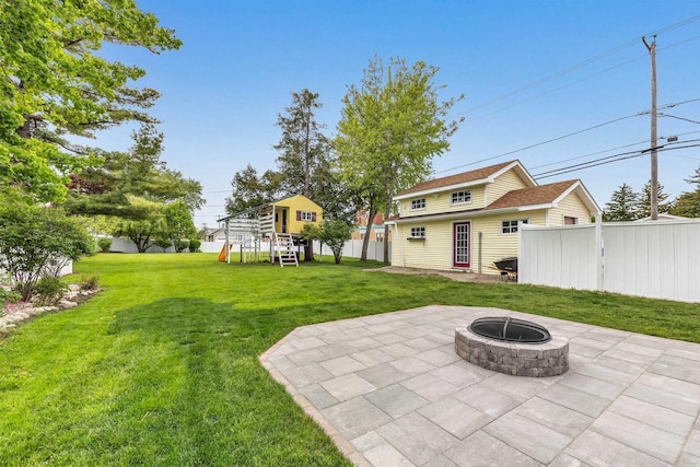 127 Flora St, Pulaski, WI 54162 - view of yard featuring a patio area and a fire pit