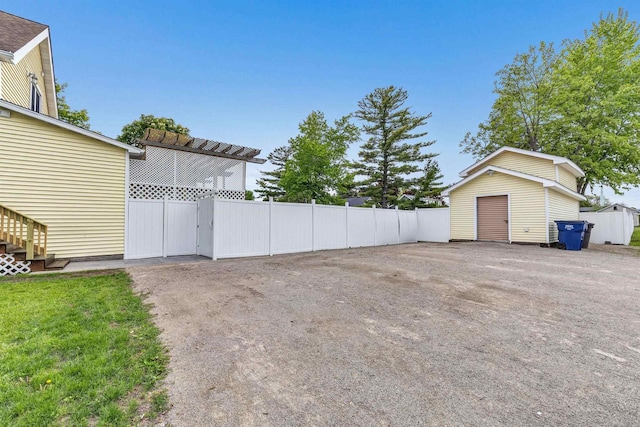 127 Flora St, Pulaski, WI 54162 - view of yard with an outbuilding