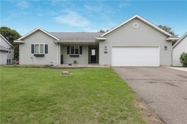 2531 Balsam Ct, Eau Claire, WI 54703 - ranch-style home featuring asphalt driveway, a garage, a front yard, and a shingled roof