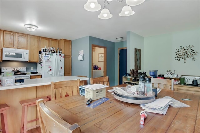 2531 Balsam Ct, Eau Claire, WI 54703 - dining space featuring a chandelier