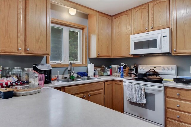 2531 Balsam Ct, Eau Claire, WI 54703 - kitchen featuring white appliances, a sink, and light countertops