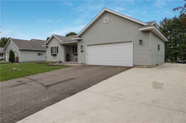 2531 Balsam Ct, Eau Claire, WI 54703 - ranch-style home with driveway, an attached garage, and a front yard