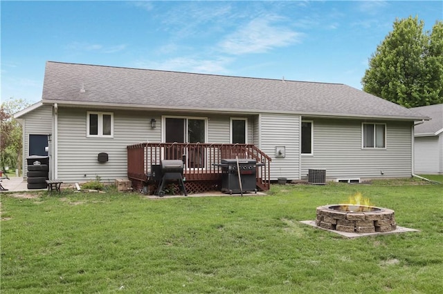 2531 Balsam Ct, Eau Claire, WI 54703 - back of property featuring an outdoor fire pit, a deck, a lawn, cooling unit, and roof with shingles