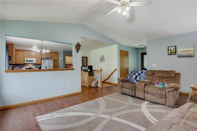 2531 Balsam Ct, Eau Claire, WI 54703 - living area with ceiling fan, lofted ceiling, wood finished floors, and baseboards