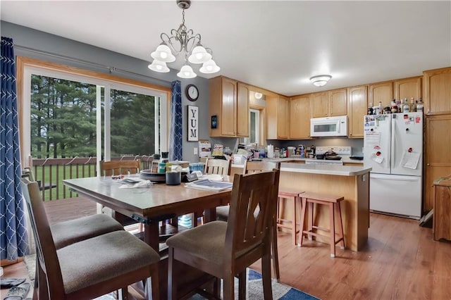 2531 Balsam Ct, Eau Claire, WI 54703 - dining area featuring light wood-style floors and a chandelier