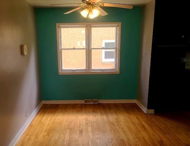 3602 N 85th St Unit 3604, Milwaukee, WI 53222 - spare room featuring ceiling fan, wood finished floors, and baseboards