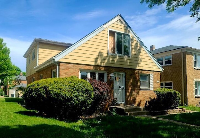 3602 N 85th St Unit 3604, Milwaukee, WI 53222 - view of front of house with brick siding and a front lawn