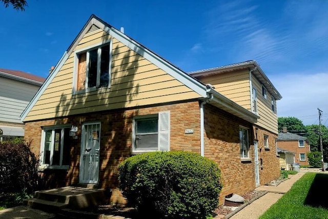 3602 N 85th St Unit 3604, Milwaukee, WI 53222 - view of side of home featuring brick siding