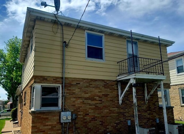3602 N 85th St Unit 3604, Milwaukee, WI 53222 - view of side of home featuring brick siding and central air condition unit