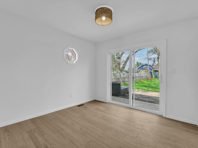 4208 Locust St, Delavan, WI 53115 - spare room with wood finished floors and baseboards