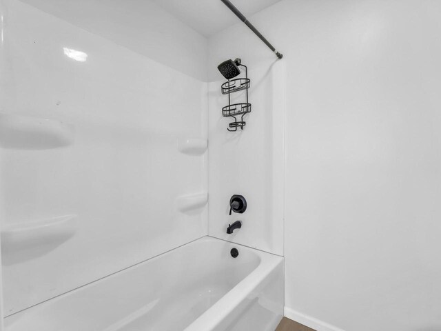 4208 Locust St, Delavan, WI 53115 - bathroom with washtub / shower combination and baseboards
