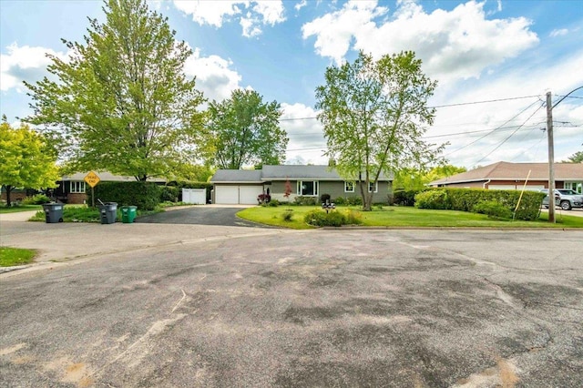 2931 N Ave, Wisconsin Rapids, WI 54495 - single story home with asphalt driveway, a garage, and a front yard