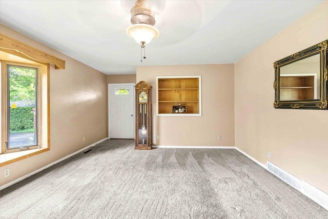 2931 N Ave, Wisconsin Rapids, WI 54495 - unfurnished room with carpet floors, baseboards, and built in shelves