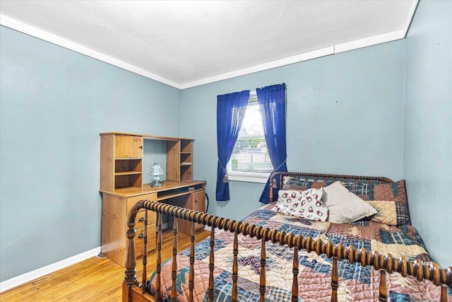 2931 N Ave, Wisconsin Rapids, WI 54495 - bedroom featuring wood finished floors, baseboards, and ornamental molding