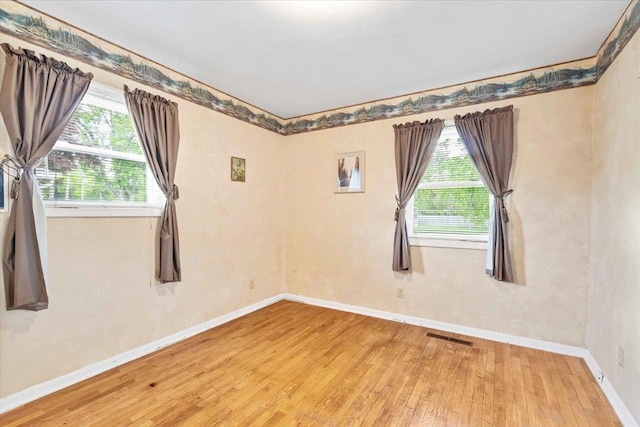 2931 N Ave, Wisconsin Rapids, WI 54495 - spare room with wood-type flooring and baseboards