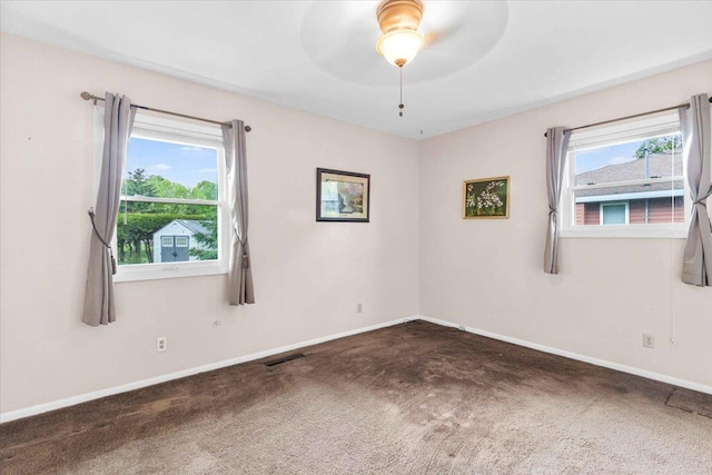 2931 N Ave, Wisconsin Rapids, WI 54495 - spare room featuring carpet flooring, baseboards, and ceiling fan