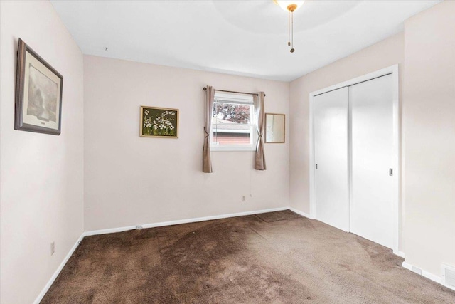 2931 N Ave, Wisconsin Rapids, WI 54495 - unfurnished bedroom featuring carpet floors, a closet, and baseboards