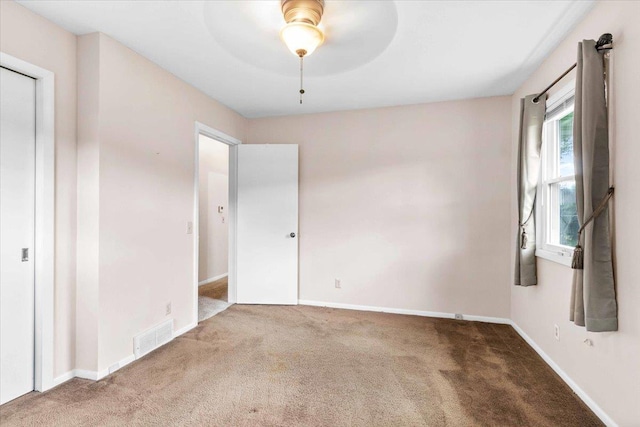 2931 N Ave, Wisconsin Rapids, WI 54495 - spare room featuring carpet floors, baseboards, and ceiling fan