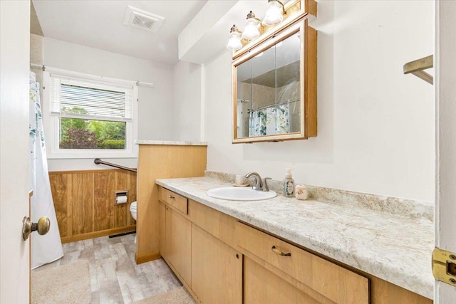 2931 N Ave, Wisconsin Rapids, WI 54495 - bathroom featuring vanity, toilet, and a shower with shower curtain