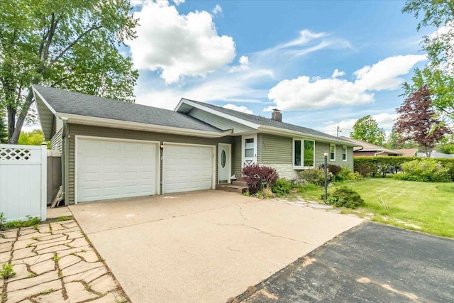 2931 N Ave, Wisconsin Rapids, WI 54495 - ranch-style house with a garage, driveway, and a chimney