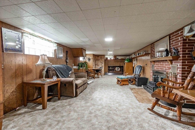 2931 N Ave, Wisconsin Rapids, WI 54495 - living area featuring a fireplace, wood walls, and carpet