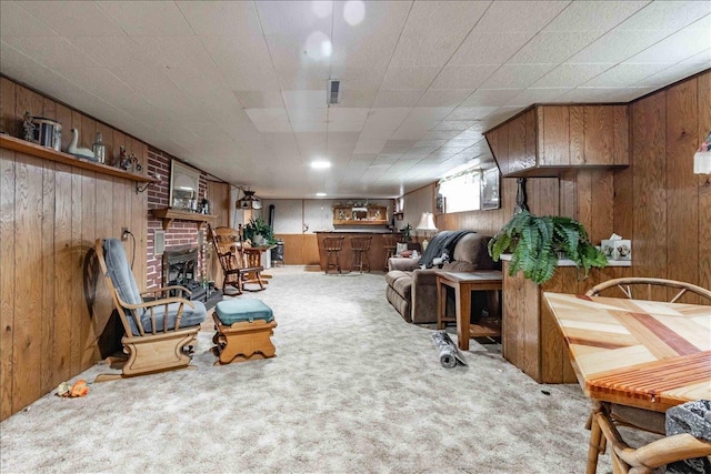 2931 N Ave, Wisconsin Rapids, WI 54495 - living area with carpet floors, wooden walls, and a fireplace