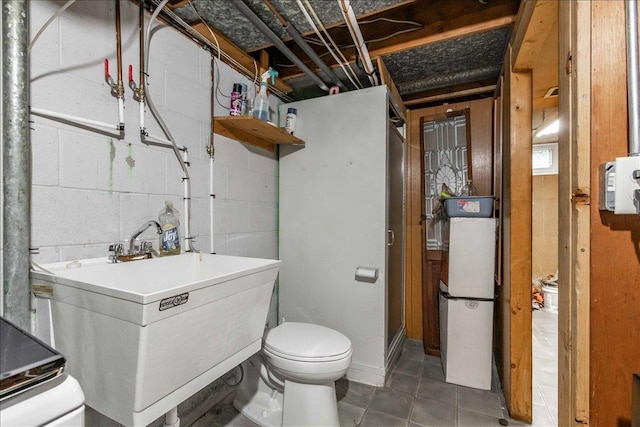 2931 N Ave, Wisconsin Rapids, WI 54495 - bathroom with toilet, concrete block wall, and a sink