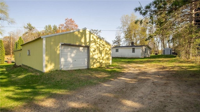 207 State Road 25, Wheeler, WI 54772 - detached garage with dirt driveway