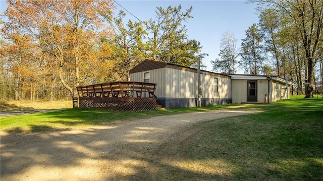 207 State Road 25, Wheeler, WI 54772 - view of side of property with a yard and a deck