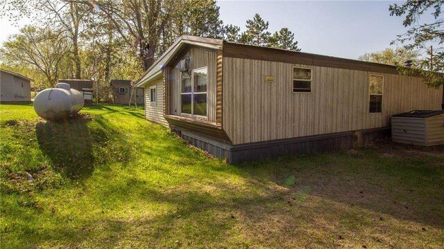 207 State Road 25, Wheeler, WI 54772 - view of side of property featuring a yard