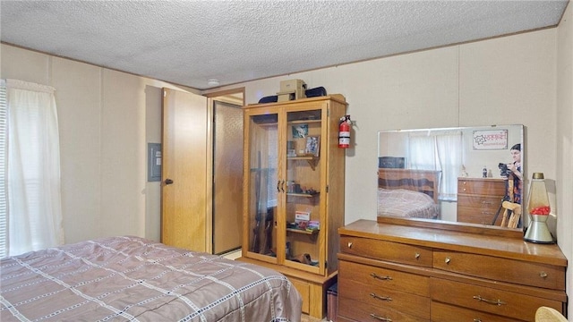 207 State Road 25, Wheeler, WI 54772 - bedroom featuring a textured ceiling