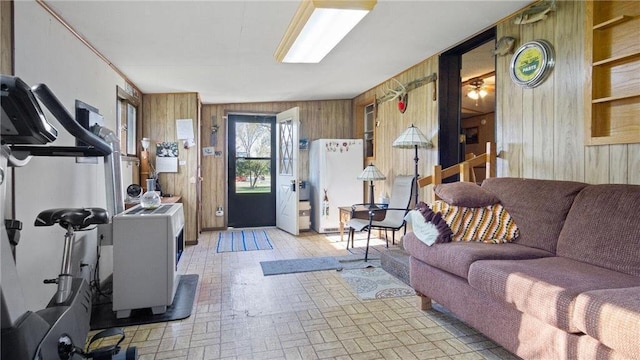 207 State Road 25, Wheeler, WI 54772 - living area featuring wooden walls and brick patterned flooring