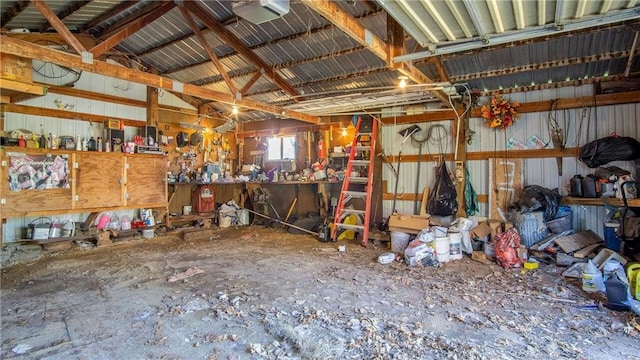 207 State Road 25, Wheeler, WI 54772 - garage featuring a garage door opener, a workshop area, and metal wall