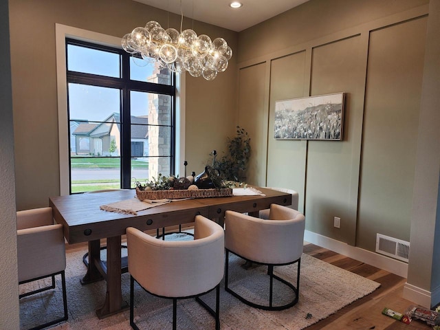 1102 Moll Dr, Waunakee, WI 53597 - dining area featuring wood finished floors, a chandelier, and recessed lighting