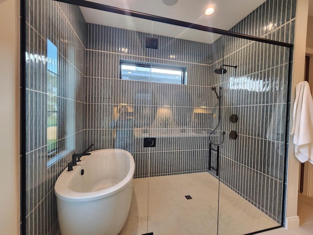 1102 Moll Dr, Waunakee, WI 53597 - full bath with a shower stall, tile walls, and tile patterned flooring