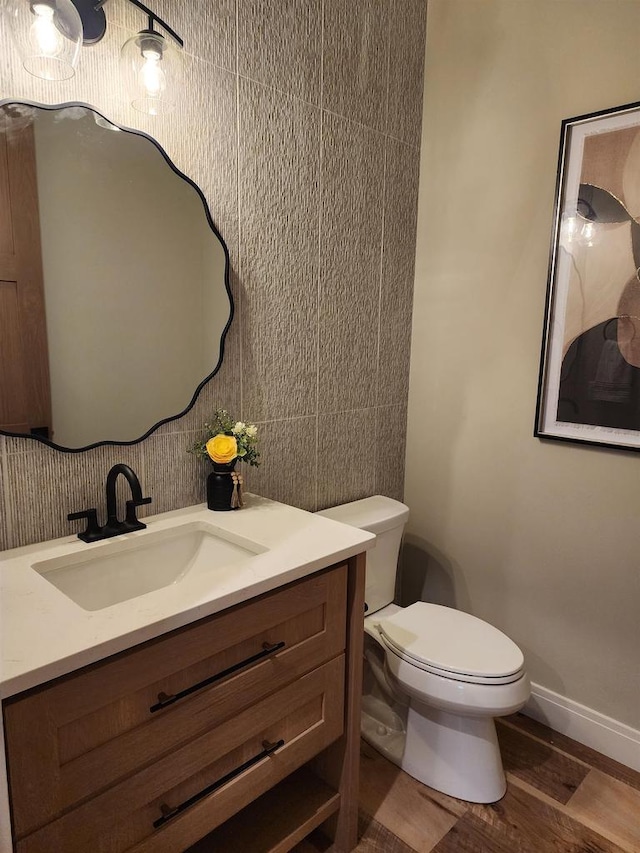 1102 Moll Dr, Waunakee, WI 53597 - half bathroom featuring vanity and wood finished floors