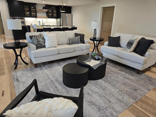 1102 Moll Dr, Waunakee, WI 53597 - living room with light wood-type flooring and baseboards