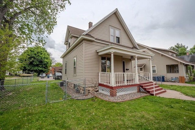 1401 N 2nd St, Wausau, WI 54403 - view of front facade featuring covered porch, a gate, and a chimney