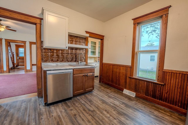 1401 N 2nd St, Wausau, WI 54403 - kitchen with dishwasher, a sink, a wainscoted wall, healthy amount of natural light, and light countertops