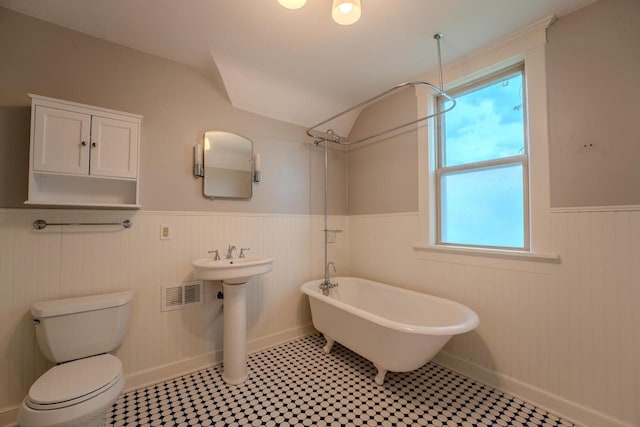 1401 N 2nd St, Wausau, WI 54403 - bathroom with a wainscoted wall, toilet, and a sink