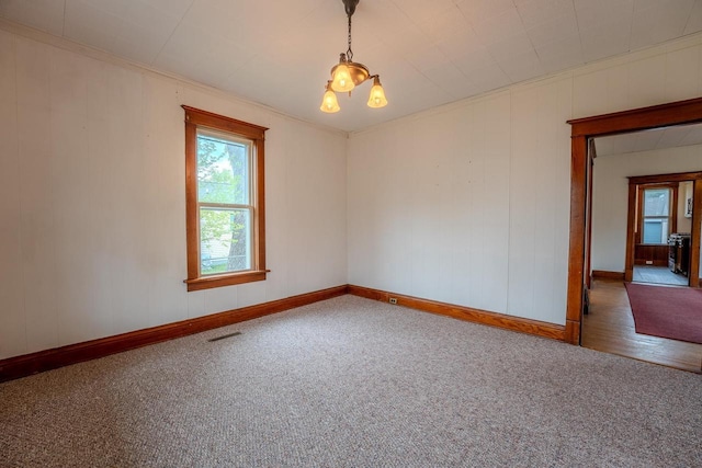 1401 N 2nd St, Wausau, WI 54403 - carpeted empty room featuring baseboards and ornamental molding