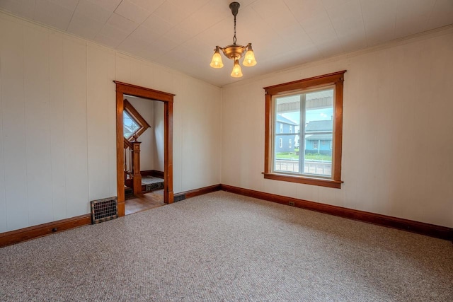 1401 N 2nd St, Wausau, WI 54403 - unfurnished room featuring a chandelier, carpet flooring, crown molding, and baseboards
