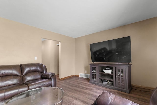 1208 Grove St, Menasha, WI 54952 - living area featuring wood finished floors and baseboards