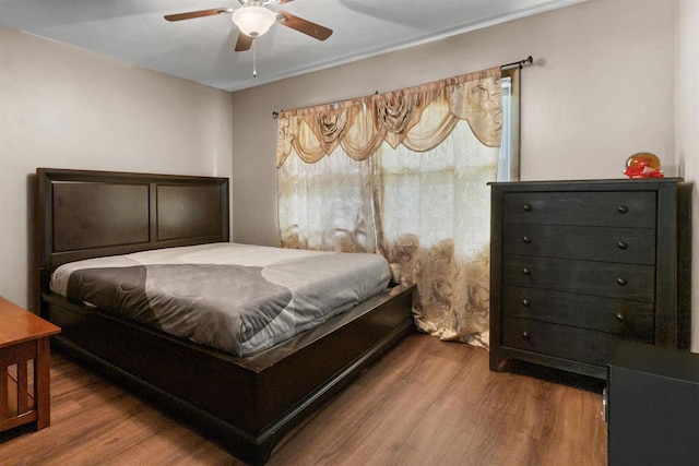 1208 Grove St, Menasha, WI 54952 - bedroom with wood finished floors and ceiling fan