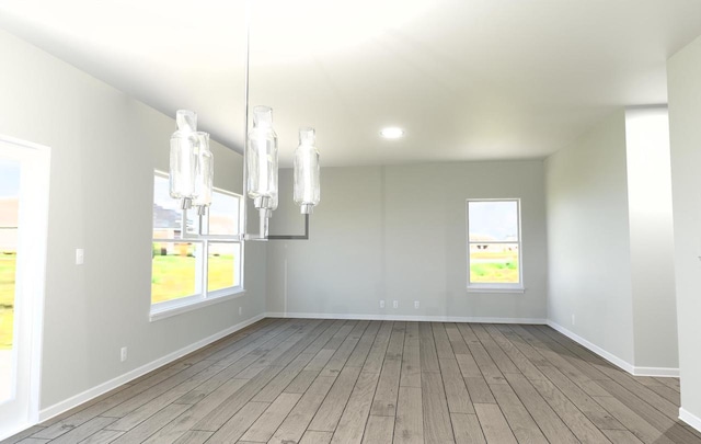 460 Parker Dr Unit Lt6, Genoa City, WI 53128 - unfurnished dining area with wood finished floors, healthy amount of natural light, baseboards, and recessed lighting