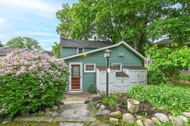 2811 Alpine Ln, Delavan, WI 53115 - view of front of house with a chimney and a gate