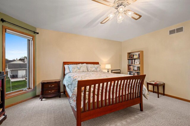 1346 Partridge Ct, Oshkosh, WI 54904 - carpeted bedroom featuring baseboards and a ceiling fan