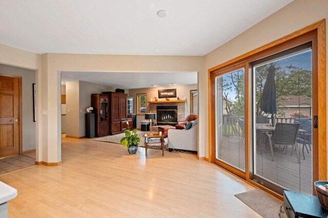 1346 Partridge Ct, Oshkosh, WI 54904 - living room with light wood finished floors, baseboards, and a fireplace